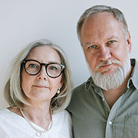 An image of a retired male and female married couple standing together